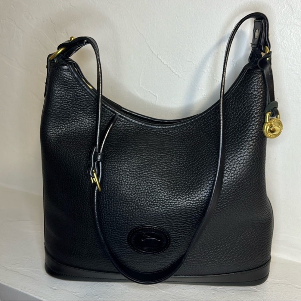Vtg. Dooney & Bourke black pebbled all weather leather bag